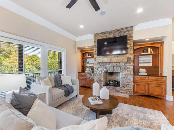 a living room with furniture and a fireplace