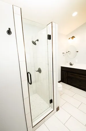 a bathroom with a sink and shower