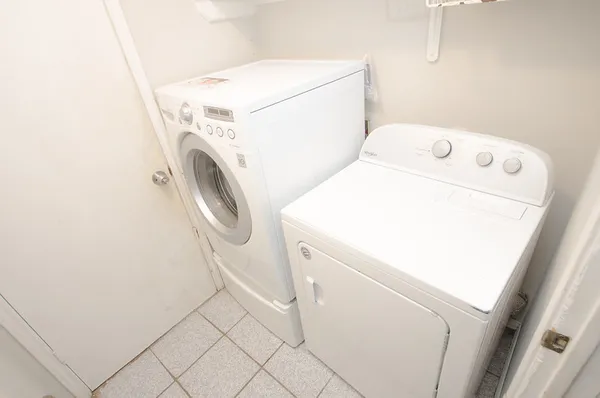 a patio with patio lots of chairs and a table