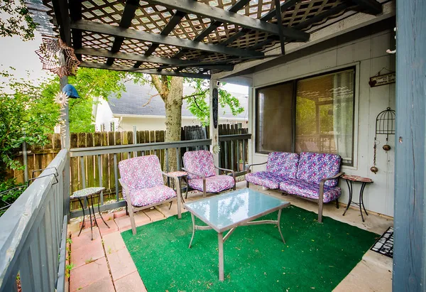 a view of a table and chairs in the garden