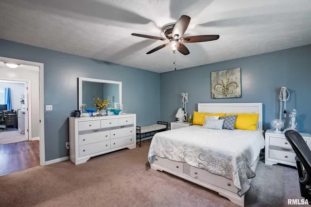 a bedroom with a bed and furniture