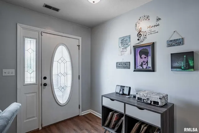 a view of workspace with furniture and wooden floor