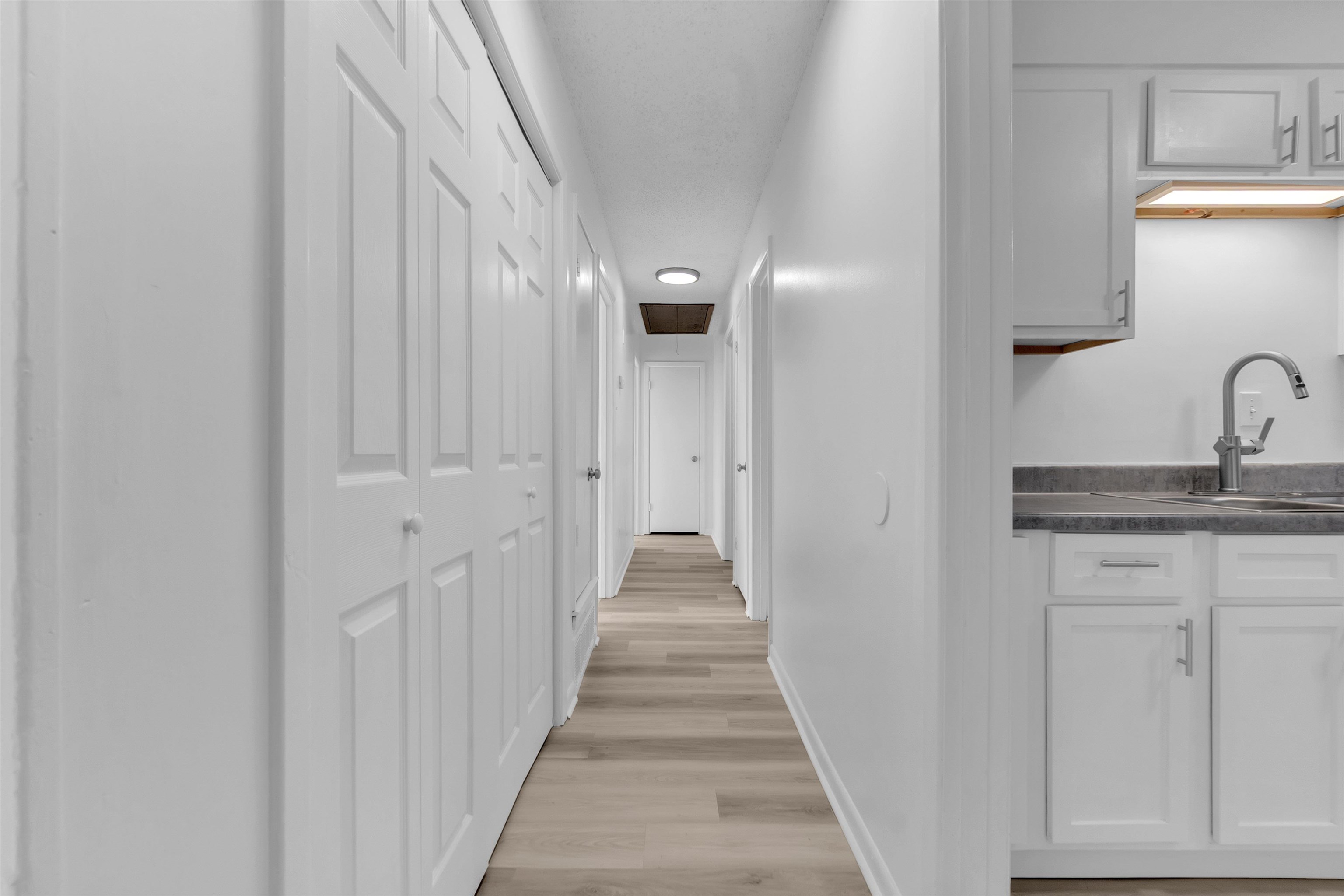 4579 Crump Road Memphis, TN 38141 - Photo 11 of 18 a view of a hallway with wooden floor and staircase