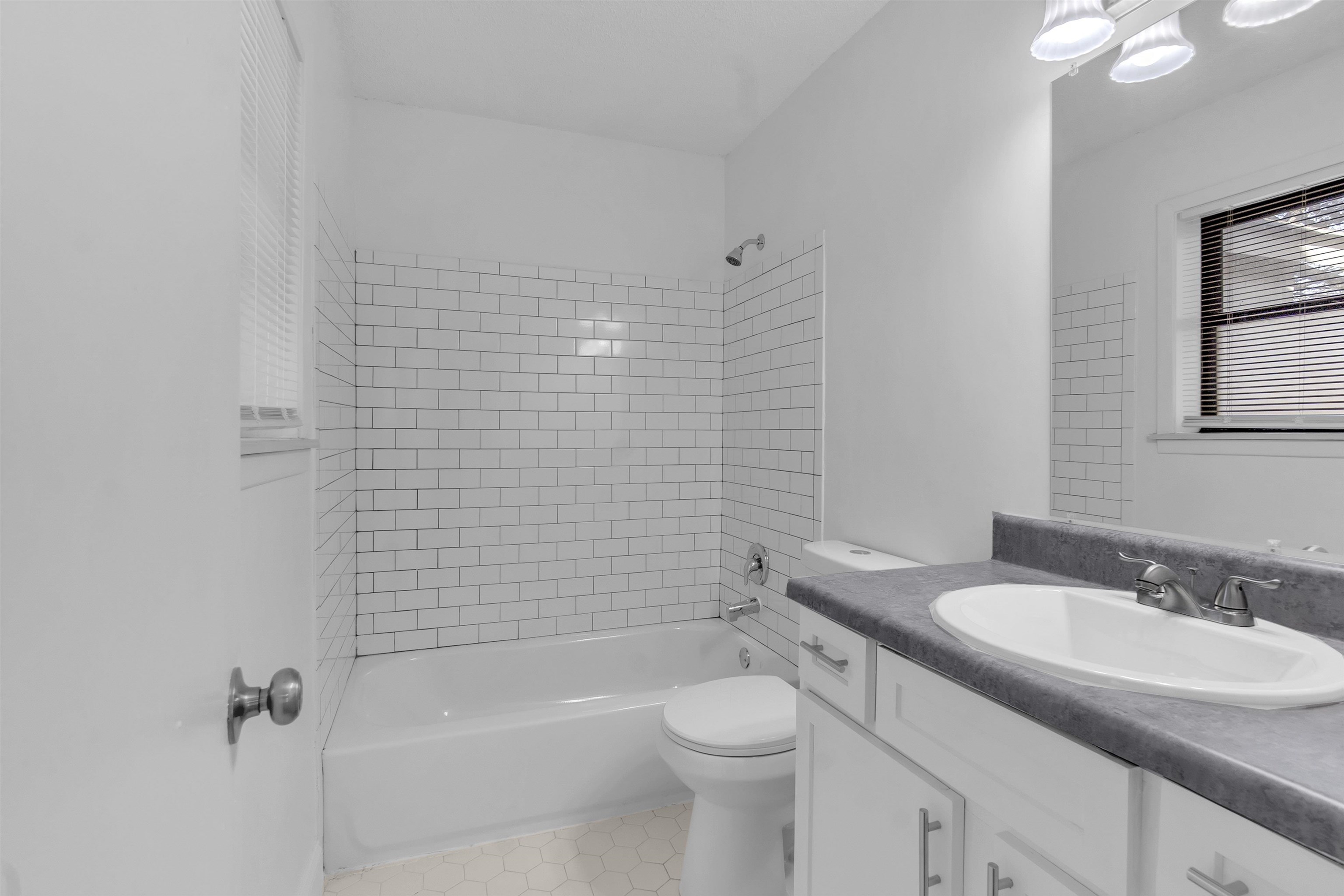 4579 Crump Road Memphis, TN 38141 - Photo 12 of 18 a bathroom with a sink toilet and shower