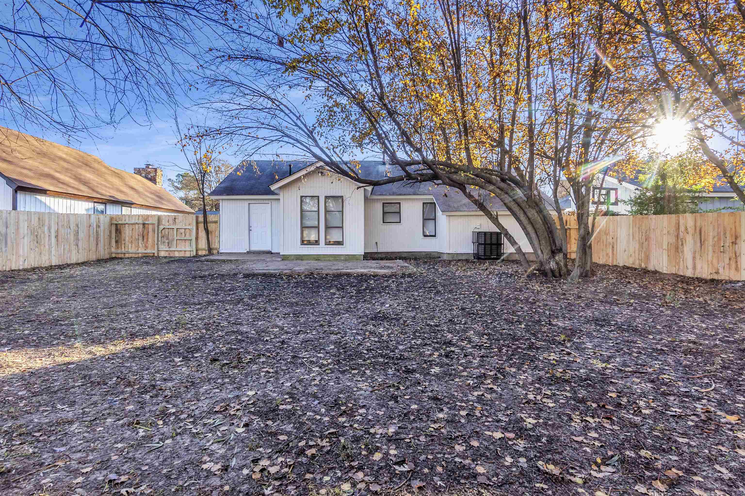 4579 Crump Road Memphis, TN 38141 - Photo 18 of 18 a house that has a tree in front of it