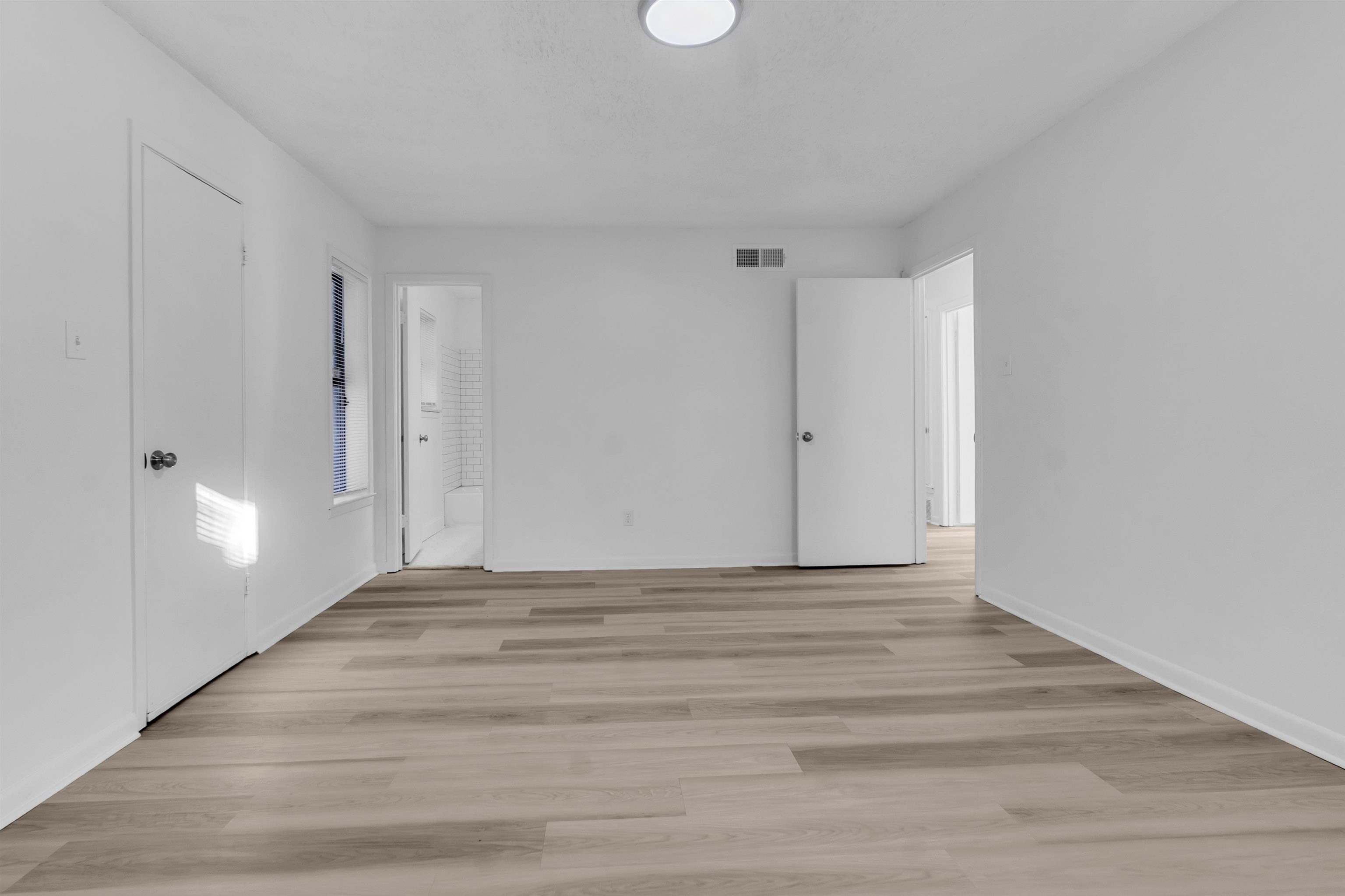 4579 Crump Road Memphis, TN 38141 - Photo 7 of 18 a view of an empty room with wooden floor