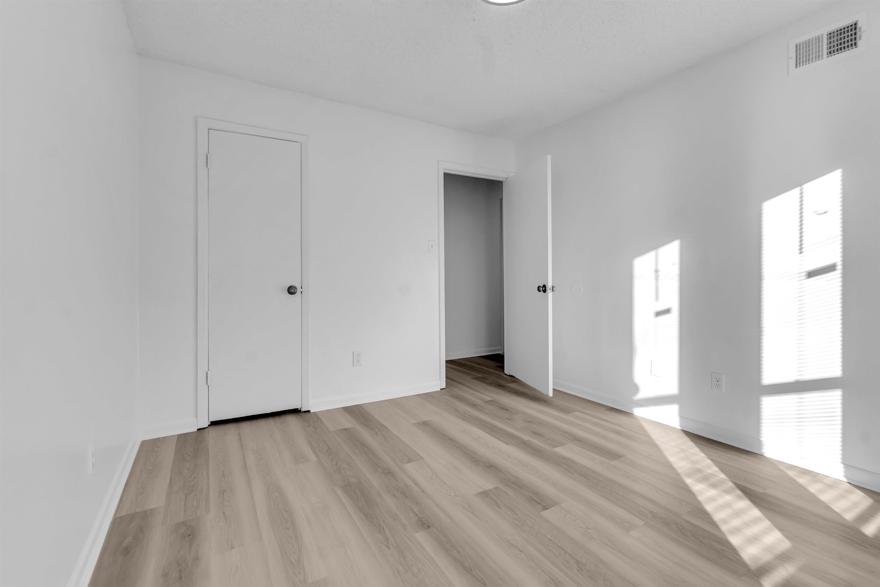 4579 Crump Road Memphis, TN 38141 - Photo 8 of 18 a view of empty room with wooden floor and fan