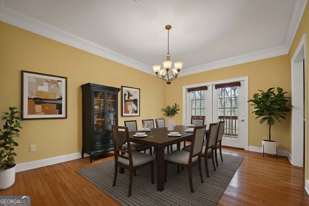 220 Oak Ridge Road Ellijay, GA 30536 - Photo 11 of 36 a view of a dining room with furniture and wooden floor