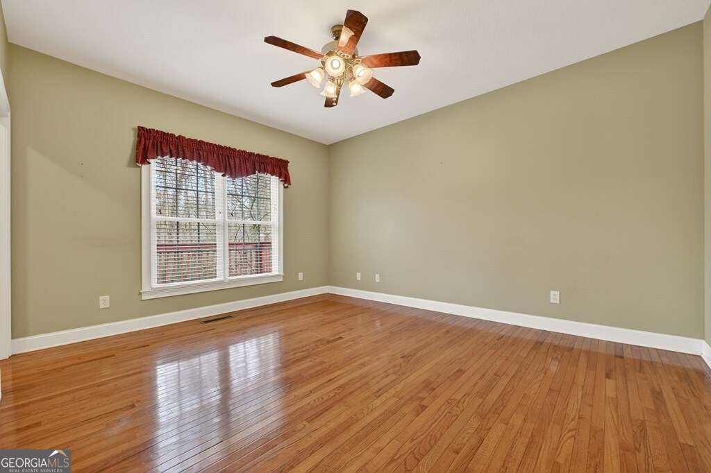 220 Oak Ridge Road Ellijay, GA 30536 - Photo 13 of 36 wooden floor in an empty room with a window