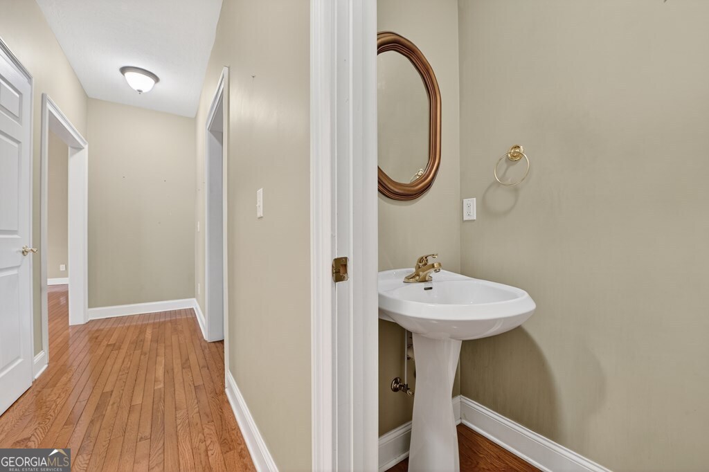 220 Oak Ridge Road Ellijay, GA 30536 - Photo 15 of 36 a bathroom with a sink a mirror and a shower