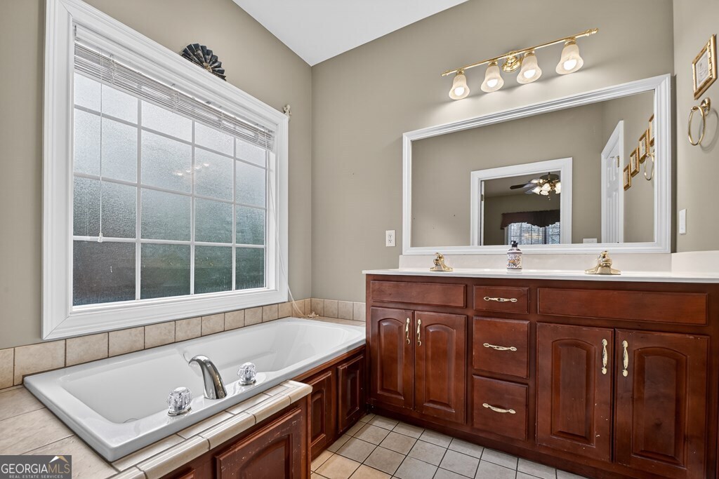 220 Oak Ridge Road Ellijay, GA 30536 - Photo 17 of 36 a bathroom with a sink double vanity and a mirror