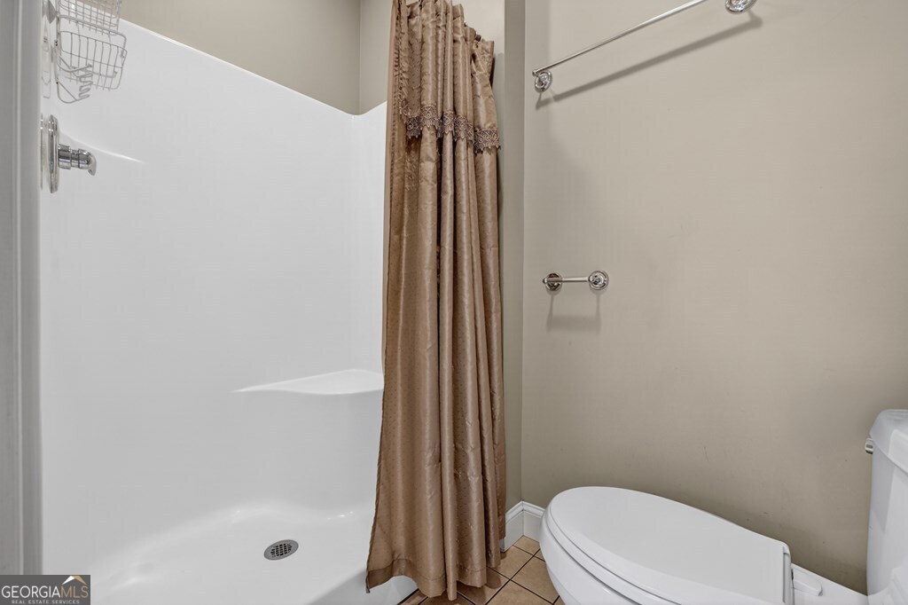 220 Oak Ridge Road Ellijay, GA 30536 - Photo 19 of 36 a bathroom with a shower and a toilet