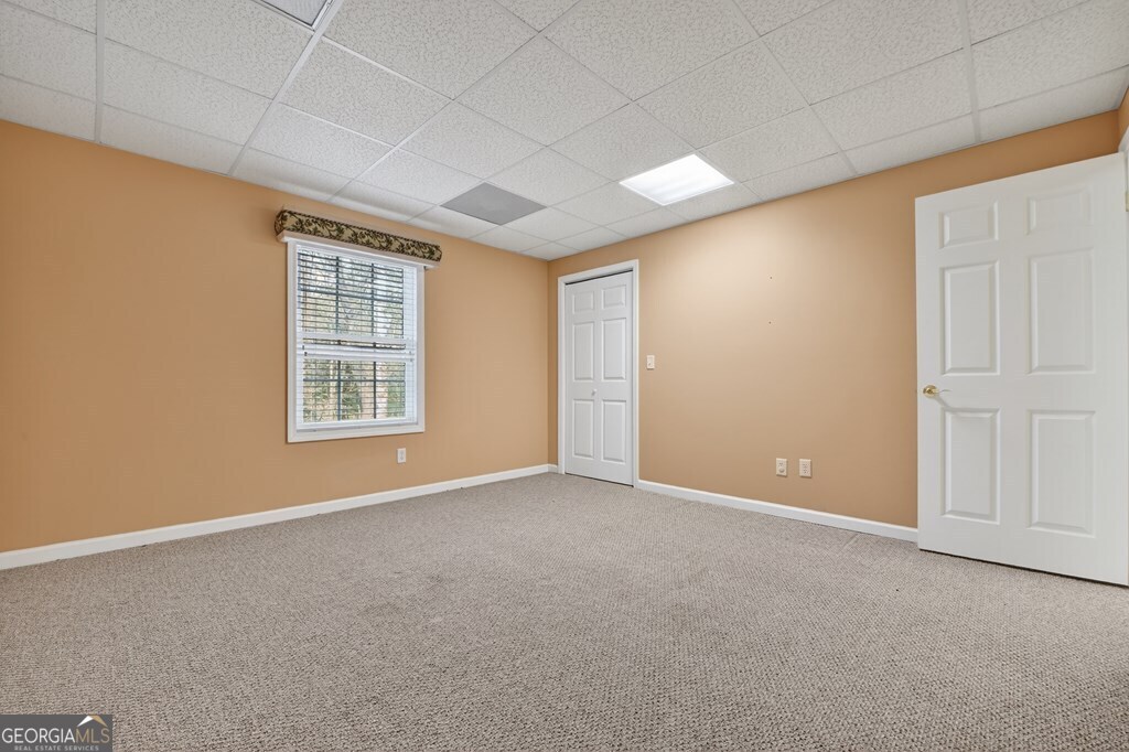 220 Oak Ridge Road Ellijay, GA 30536 - Photo 26 of 36 an empty room with windows