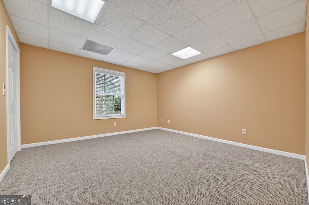 220 Oak Ridge Road Ellijay, GA 30536 - Photo 27 of 36 an empty room with windows