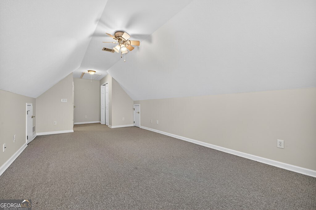 220 Oak Ridge Road Ellijay, GA 30536 - Photo 30 of 36 a view of a room with a chandelier fan and a window