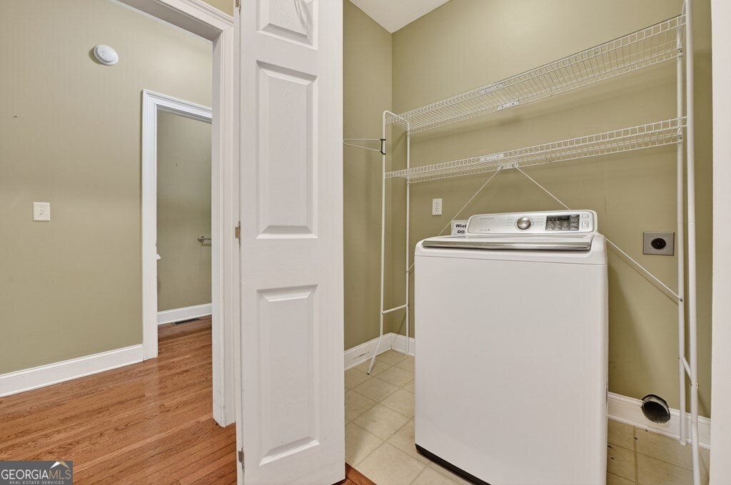 220 Oak Ridge Road Ellijay, GA 30536 - Photo 31 of 36 a utility room with wooden floor washer and dryer