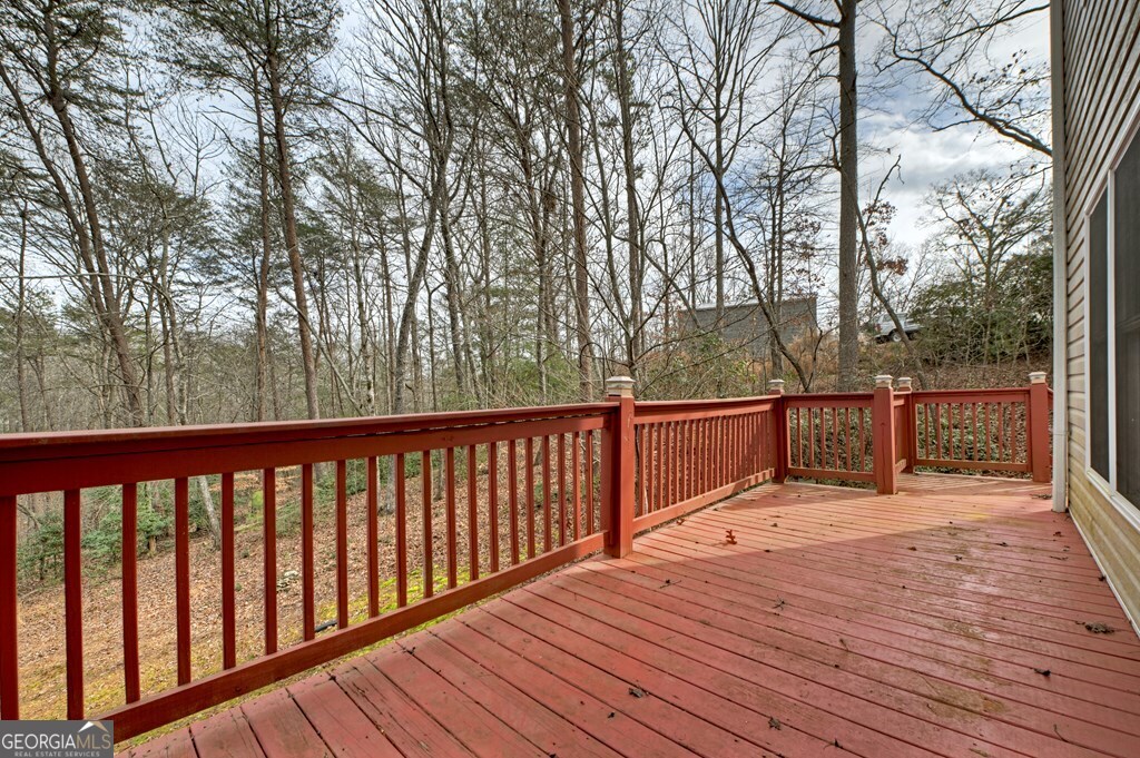 220 Oak Ridge Road Ellijay, GA 30536 - Photo 34 of 36 a balcony with wooden floor and outdoor space
