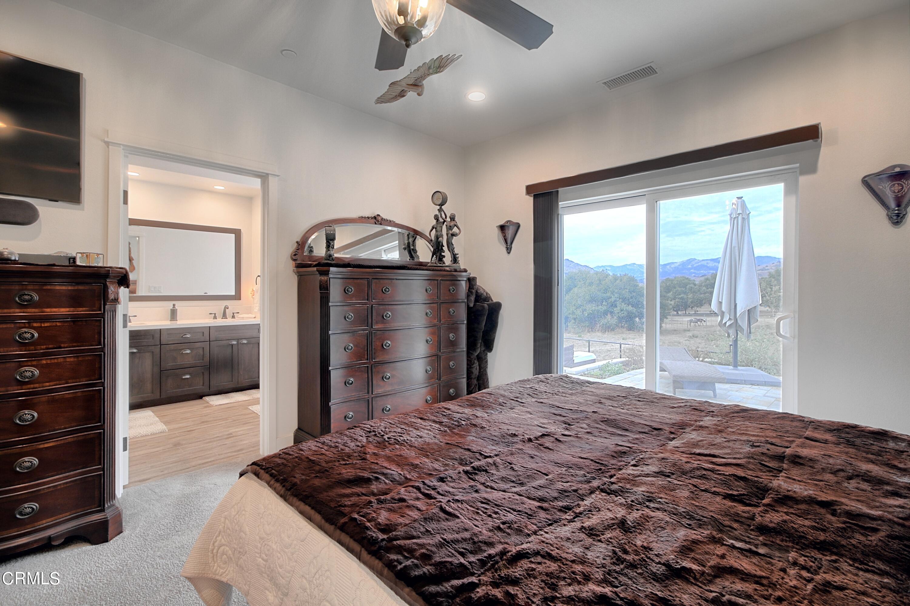 357 Los Cabos Lane Ventura, CA 93001 - Photo 16 of 44 a bedroom with a bed and a television on desk
