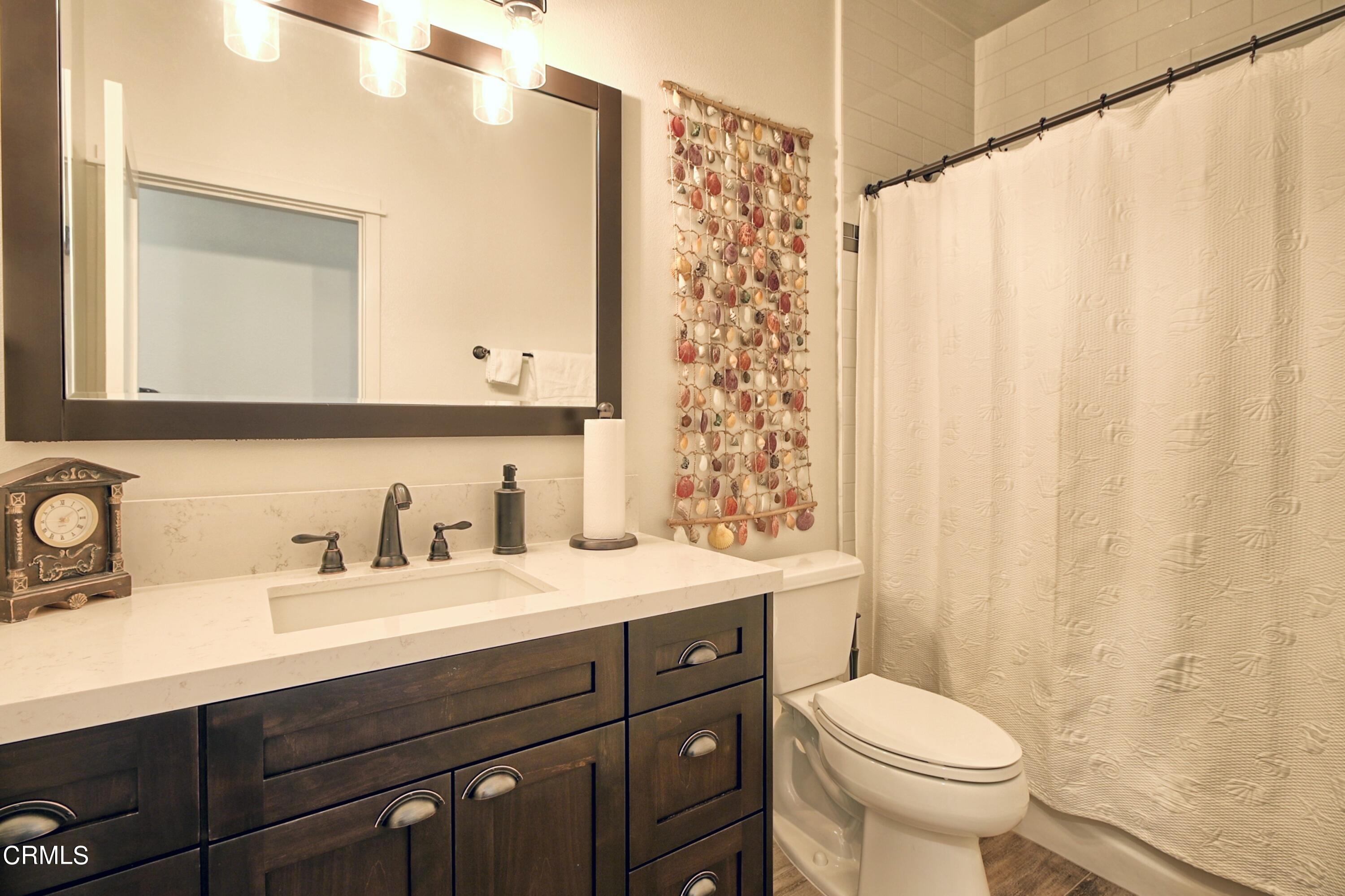 357 Los Cabos Lane Ventura, CA 93001 - Photo 20 of 44 a bathroom with a sink a toilet and a mirror
