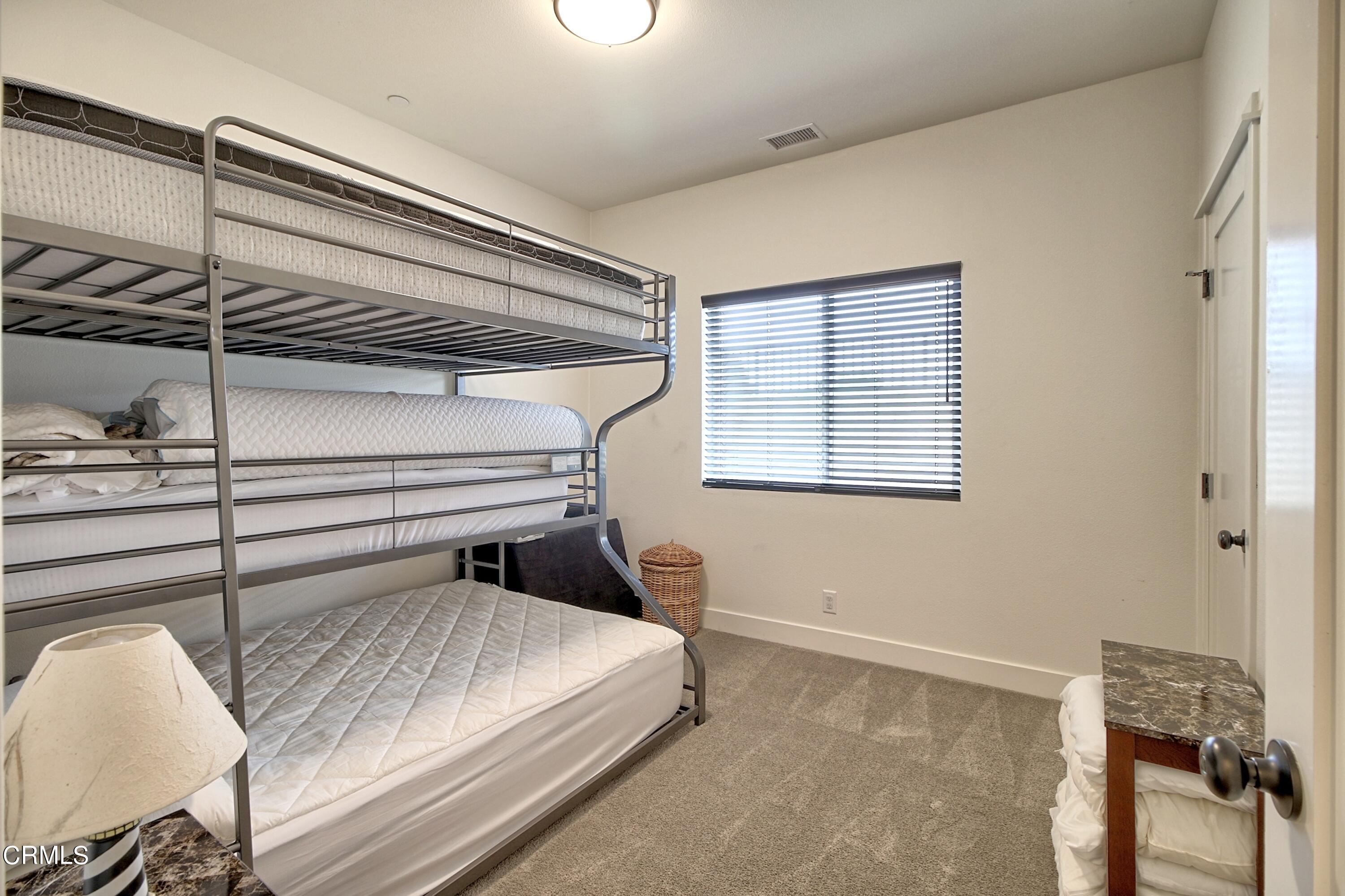 357 Los Cabos Lane Ventura, CA 93001 - Photo 21 of 44 a bedroom with a bed and a window