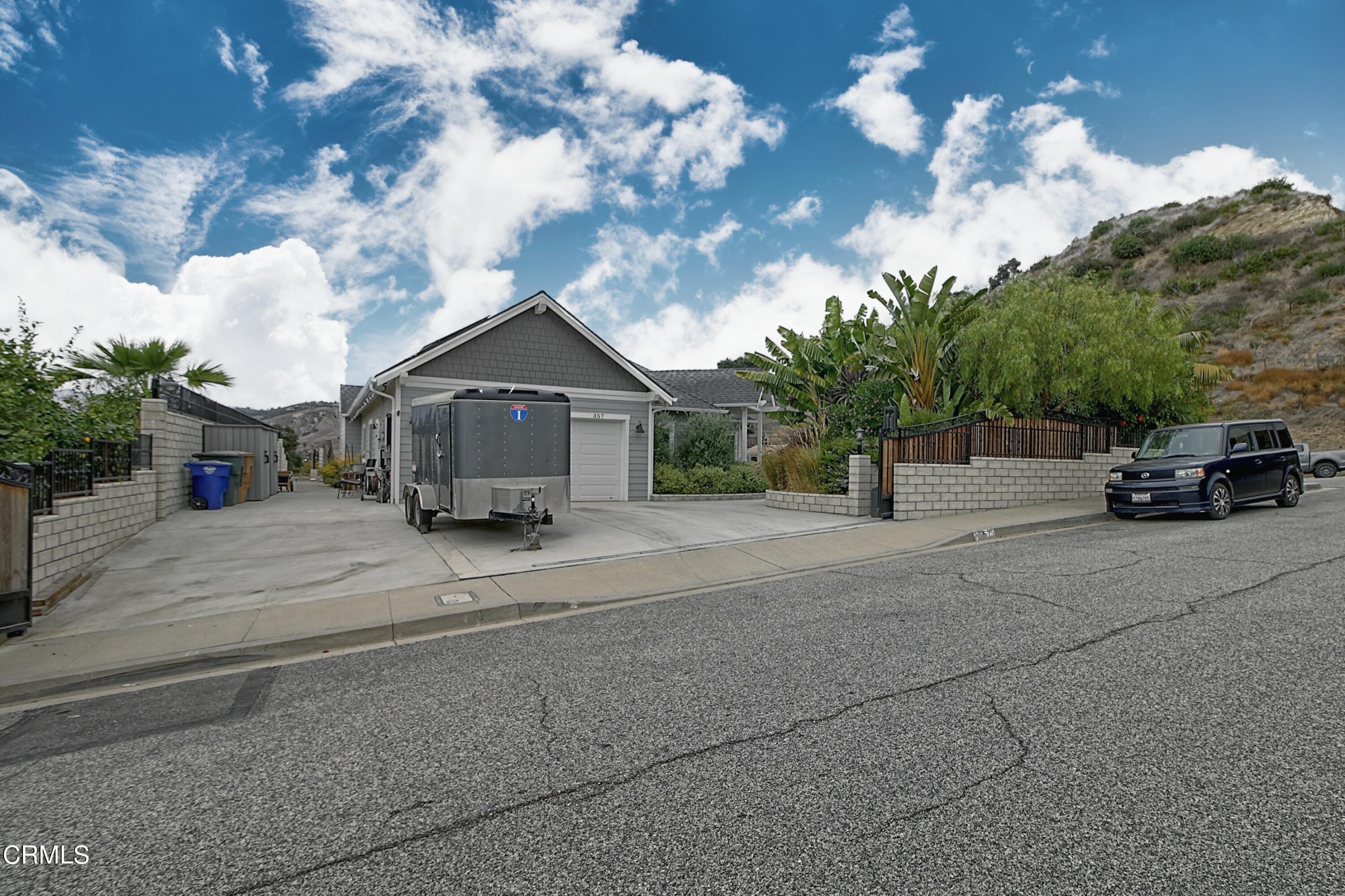 357 Los Cabos Lane Ventura, CA 93001 - Photo 31 of 44 a front view of a house with cars parked