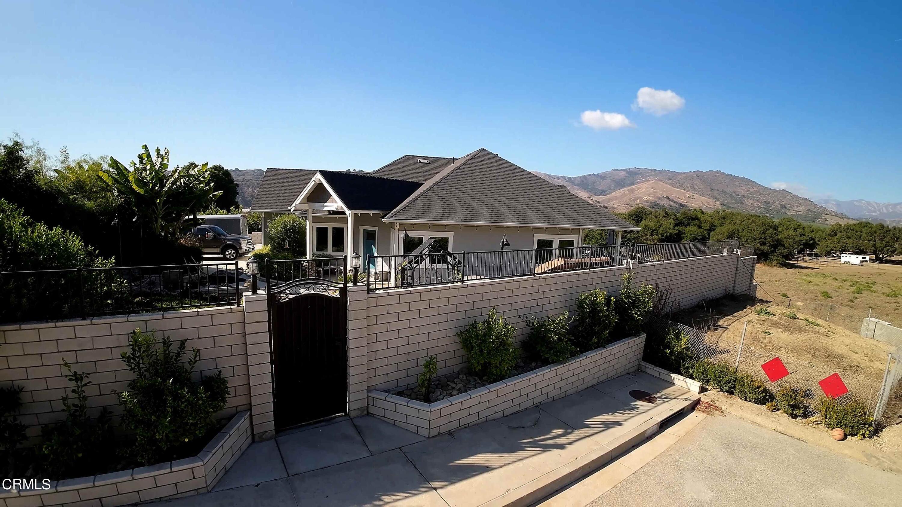 357 Los Cabos Lane Ventura, CA 93001 - Photo 38 of 44 a front view of a house with a yard