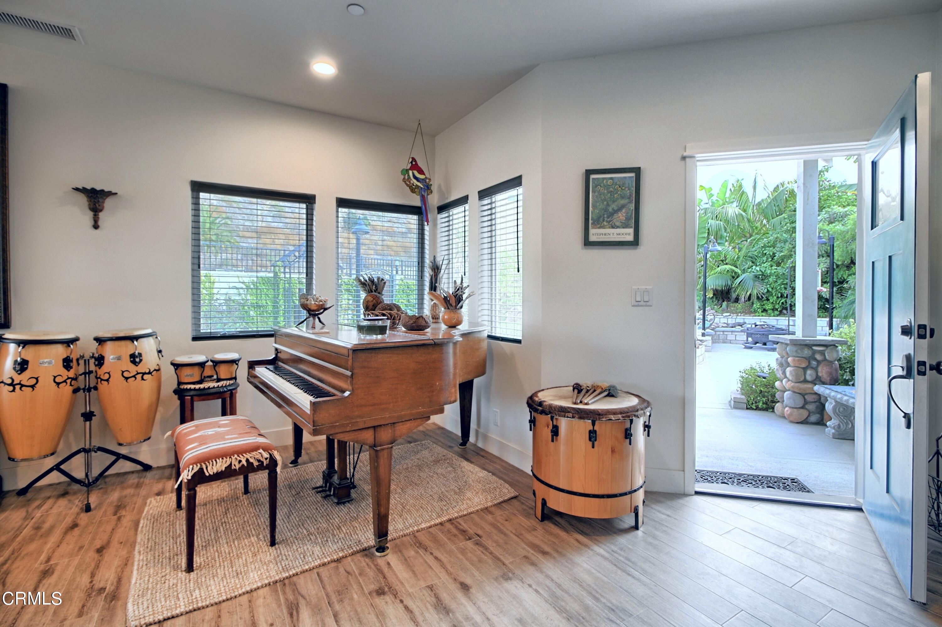 357 Los Cabos Lane Ventura, CA 93001 - Photo 6 of 44 a dining room with furniture and wooden floor