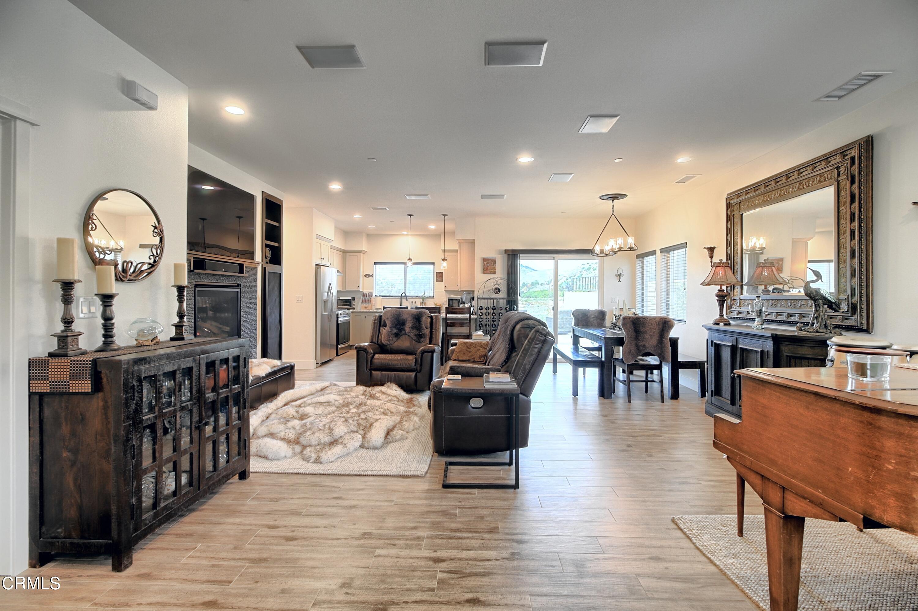 357 Los Cabos Lane Ventura, CA 93001 - Photo 8 of 44 a living room with lots of furniture and kitchen view