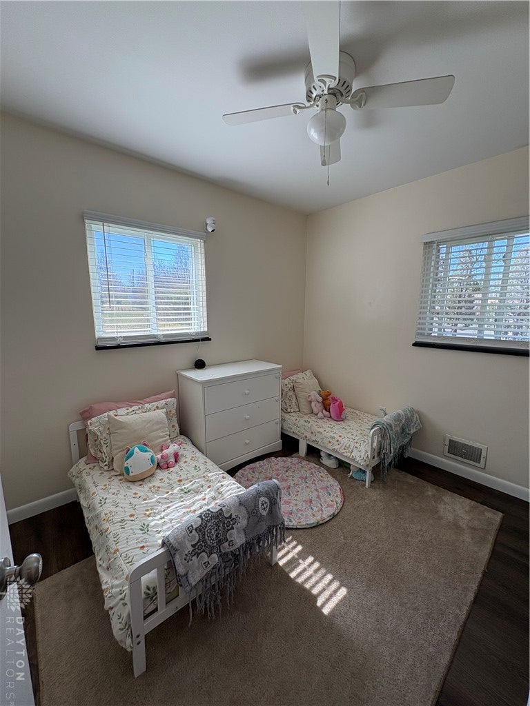 1513 Ridgeway Drive Springfield, OH 45506 - Photo 37 of 53 The bedroom features a ceiling fan and natural light from multiple windows.