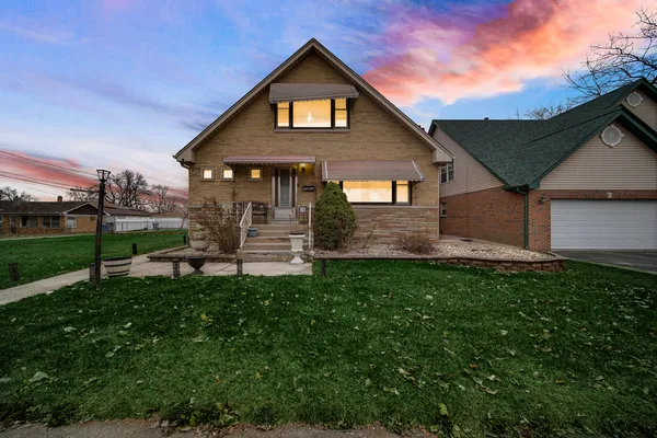 a front view of a house with a yard