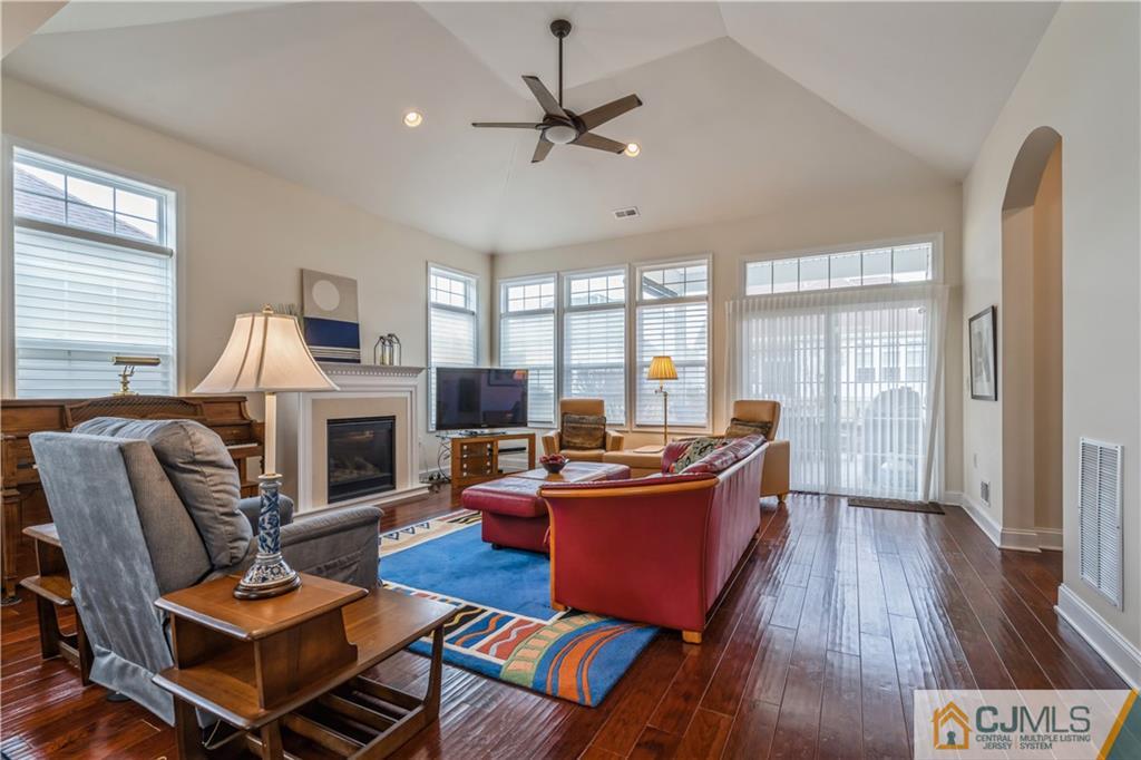 118 Cobblestone Boulevard Monroe Township, NJ 08831 - Photo 11 of 34 a living room with furniture a fireplace and a window
