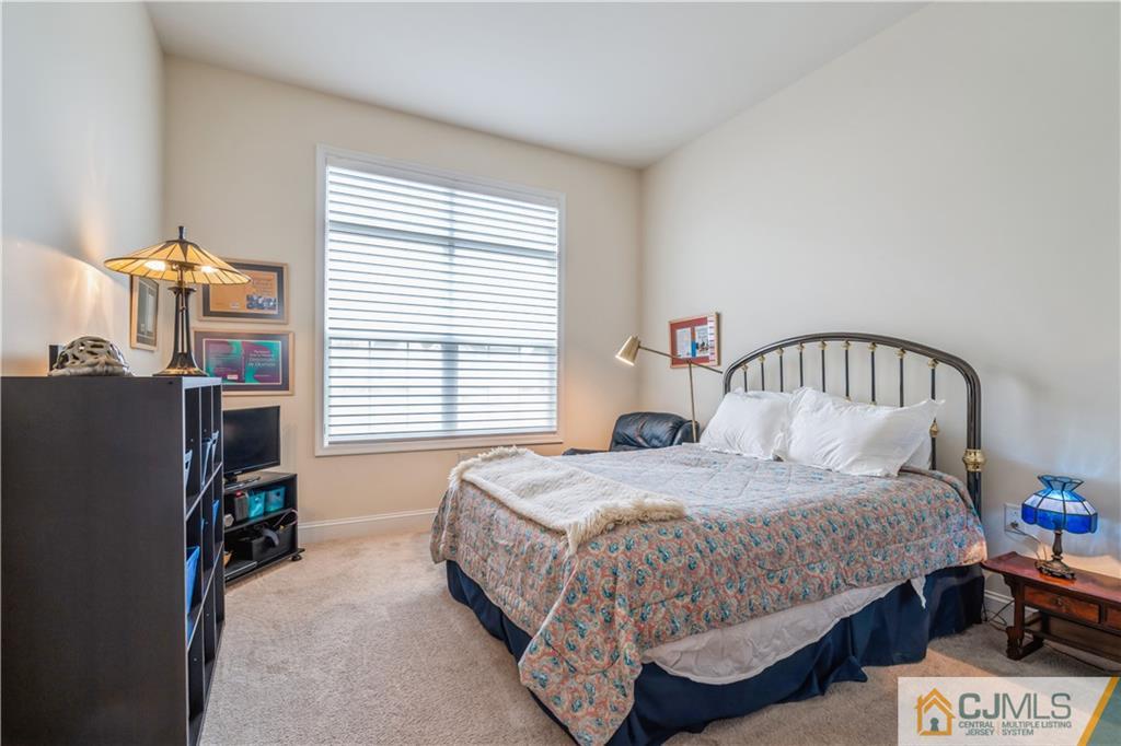 118 Cobblestone Boulevard Monroe Township, NJ 08831 - Photo 18 of 34 a bedroom with a bed and a window