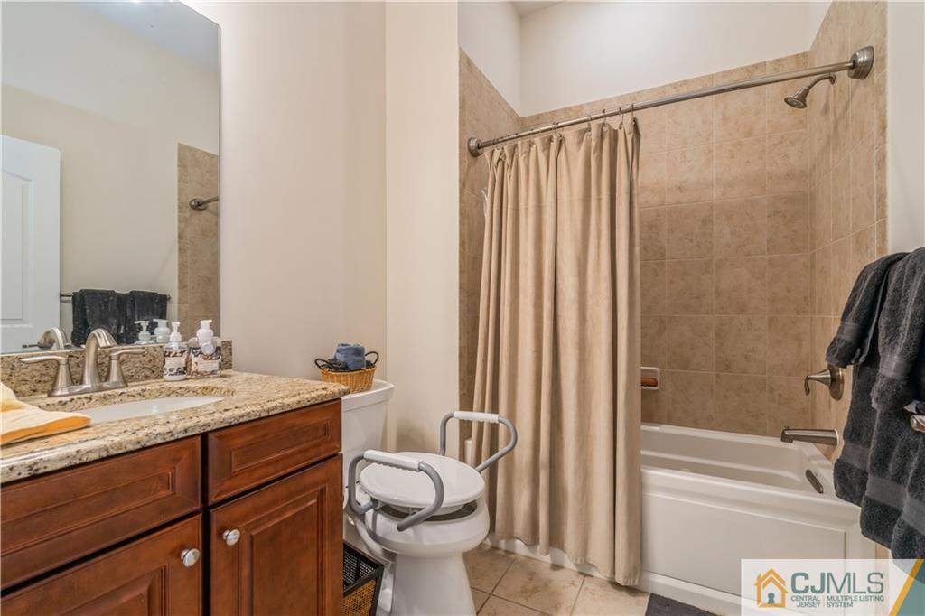 118 Cobblestone Boulevard Monroe Township, NJ 08831 - Photo 20 of 34 a bathroom with a sink a toilet and shower