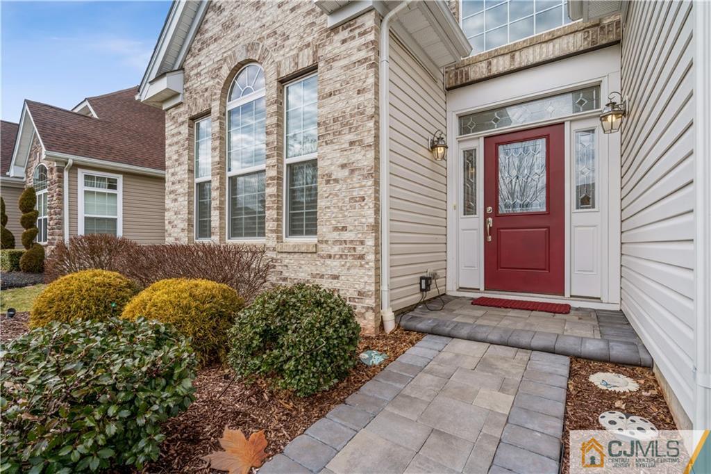 118 Cobblestone Boulevard Monroe Township, NJ 08831 - Photo 2 of 34 a view of a brick house with large windows