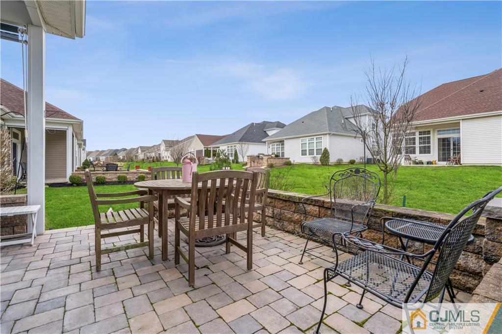 118 Cobblestone Boulevard Monroe Township, NJ 08831 - Photo 25 of 34 a view of house with backyard and outdoor seating