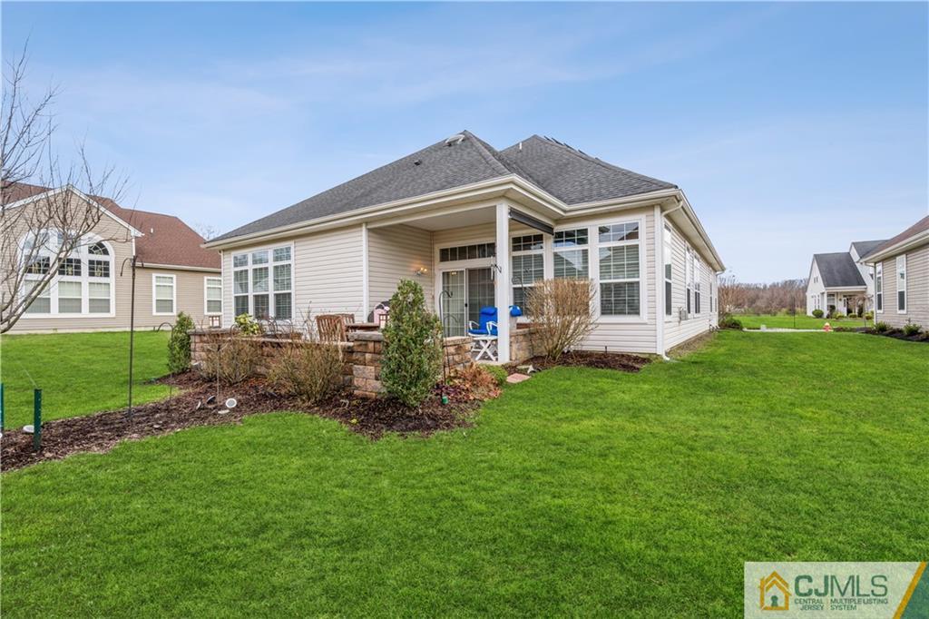 118 Cobblestone Boulevard Monroe Township, NJ 08831 - Photo 27 of 34 a front view of a house with a yard and porch
