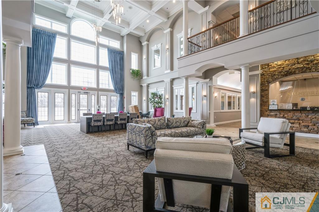118 Cobblestone Boulevard Monroe Township, NJ 08831 - Photo 29 of 34 a living room with fireplace furniture and a large window