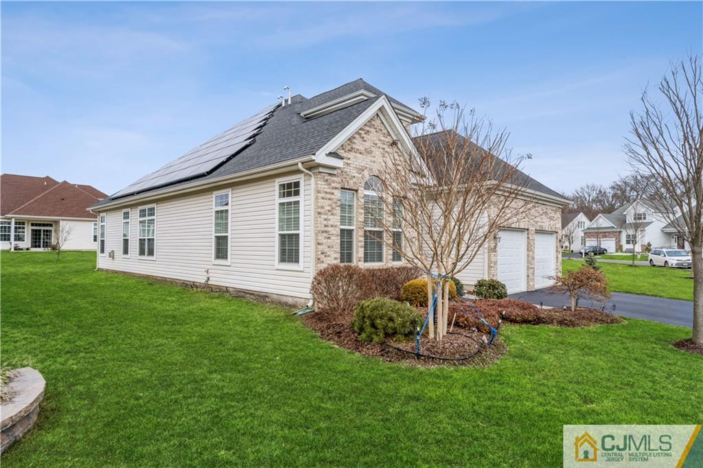 118 Cobblestone Boulevard Monroe Township, NJ 08831 - Photo 3 of 34 a view of a house with a backyard