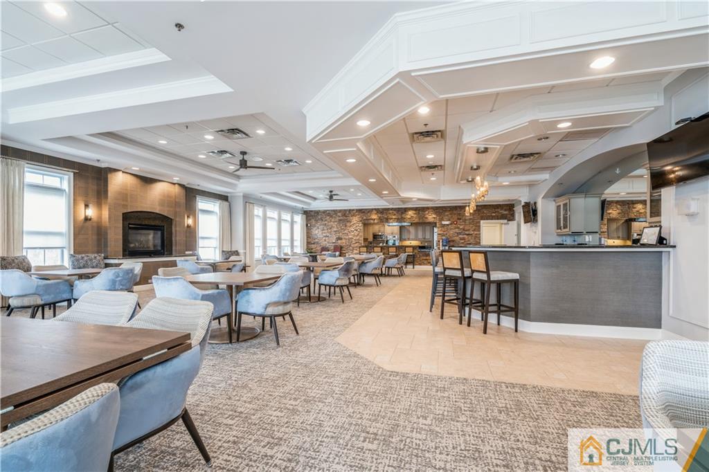 118 Cobblestone Boulevard Monroe Township, NJ 08831 - Photo 32 of 34 a living room with lots of furniture and a large window