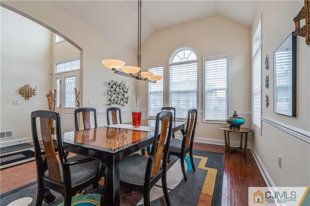 118 Cobblestone Boulevard Monroe Township, NJ 08831 - Photo 5 of 34 a view of a dining room with furniture window and wooden floor