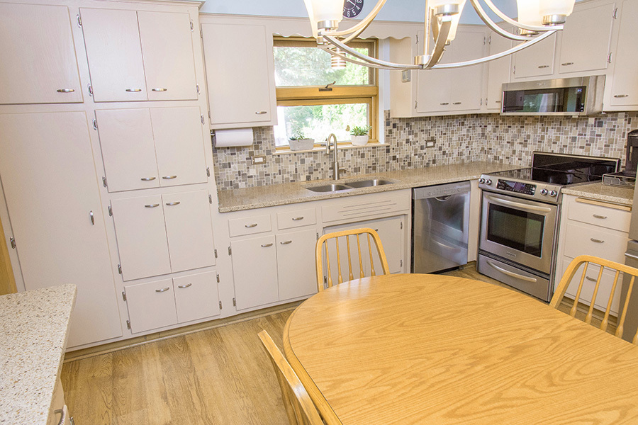 1208 Hillview Road Homewood, IL 60430 - Photo 12 of 32 a kitchen with white cabinets and white appliances
