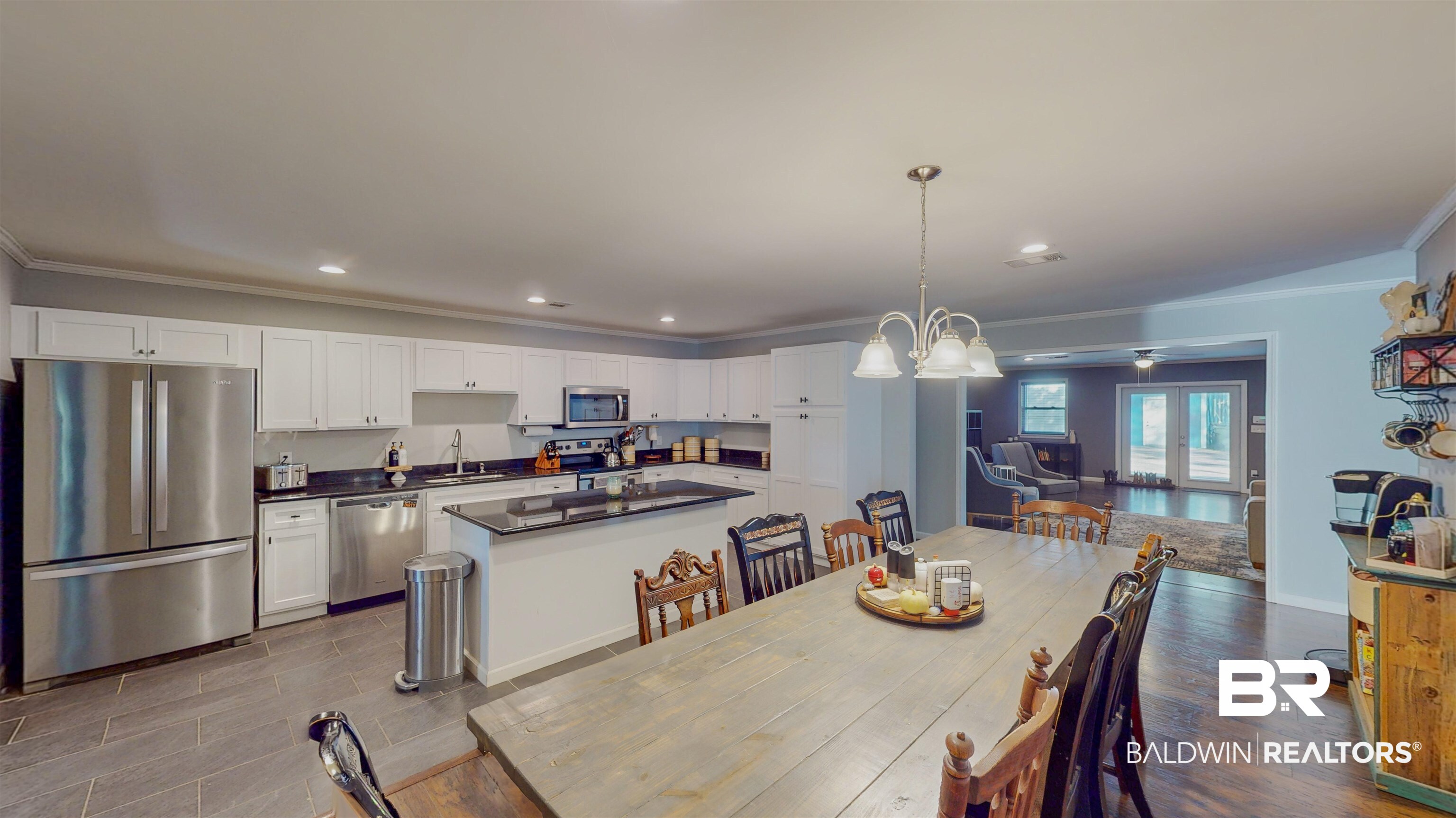 19365 Keller Road Foley, AL 36535 - Photo 5 of 41 Dining room featuring an inviting chandelier, crown molding, and sink