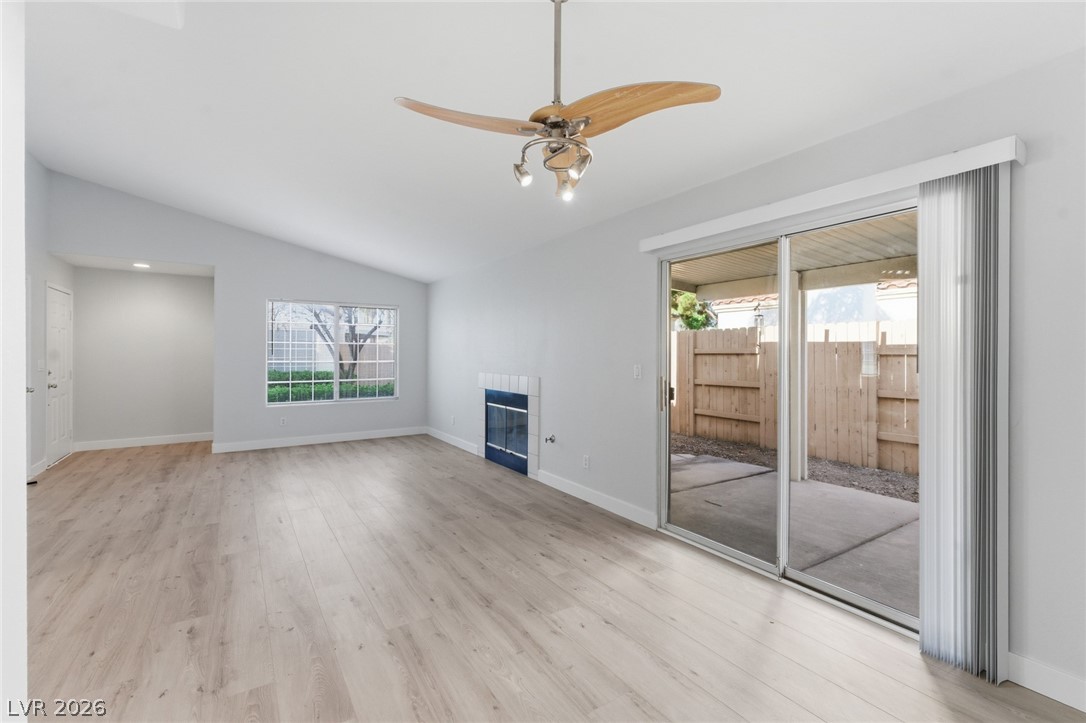 5449 Bugle Way, Unit 104 Las Vegas, NV 89108 - Photo 9 of 33 Bright and airy, this living space features high ceilings and direct outdoor access.