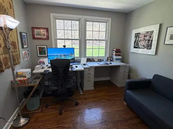 a workspace with furniture and a window