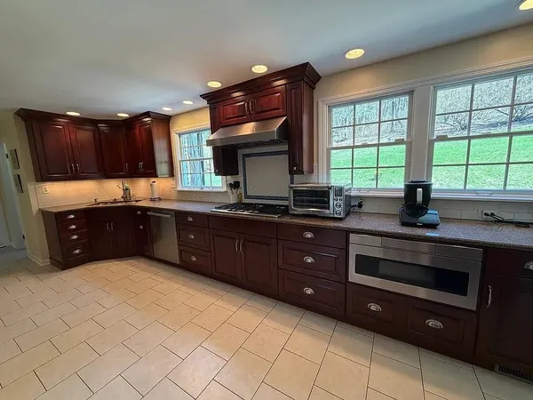 a kitchen with a sink and a window
