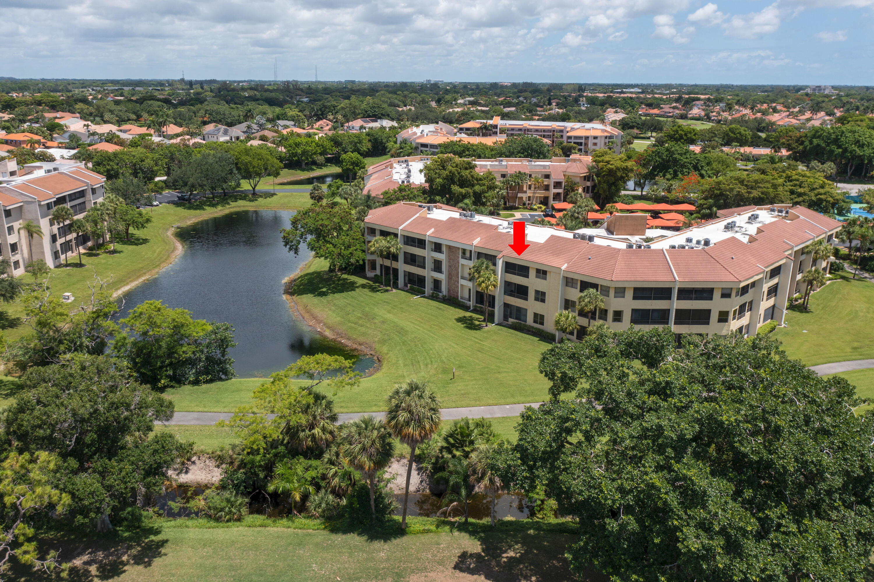 7520 La Paz Boulevard, Unit 104 Boca Raton, FL 33433 - Photo 5 of 56 an aerial view of residential houses with outdoor space and river