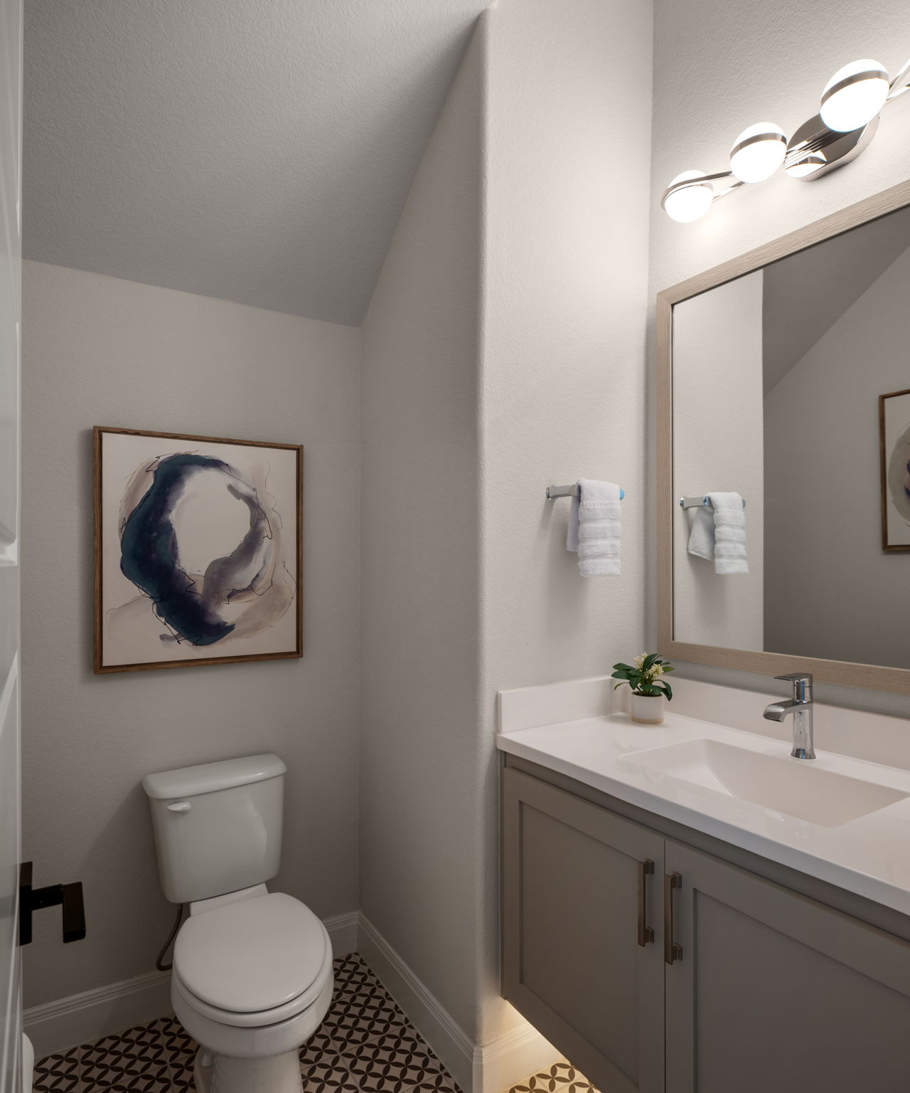 546 Bridge Water Loop Dripping Springs, TX 78620 - Photo 23 of 40 a bathroom with a toilet a sink and mirror