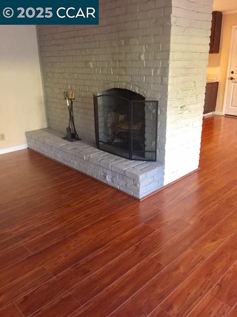 1000 Sanders Drive Moraga, CA 94556 - Photo 11 of 32 a living room with wooden floor