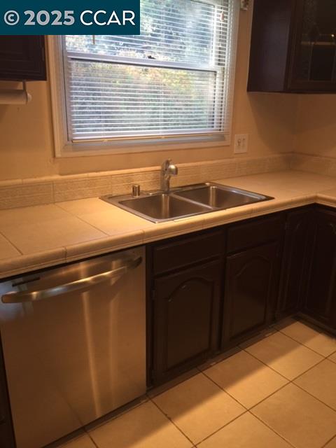1000 Sanders Drive Moraga, CA 94556 - Photo 13 of 32 a kitchen with a sink and cabinets