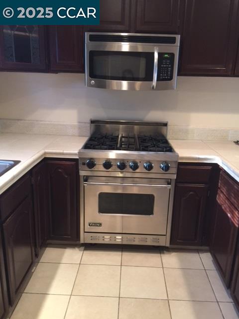 1000 Sanders Drive Moraga, CA 94556 - Photo 16 of 32 a stove top oven sitting inside of a kitchen